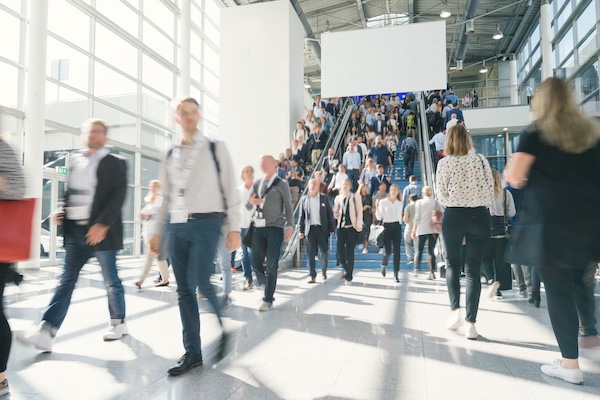 People in an airport arrival hall.